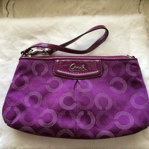 Beautiful purple Coach wristlet.